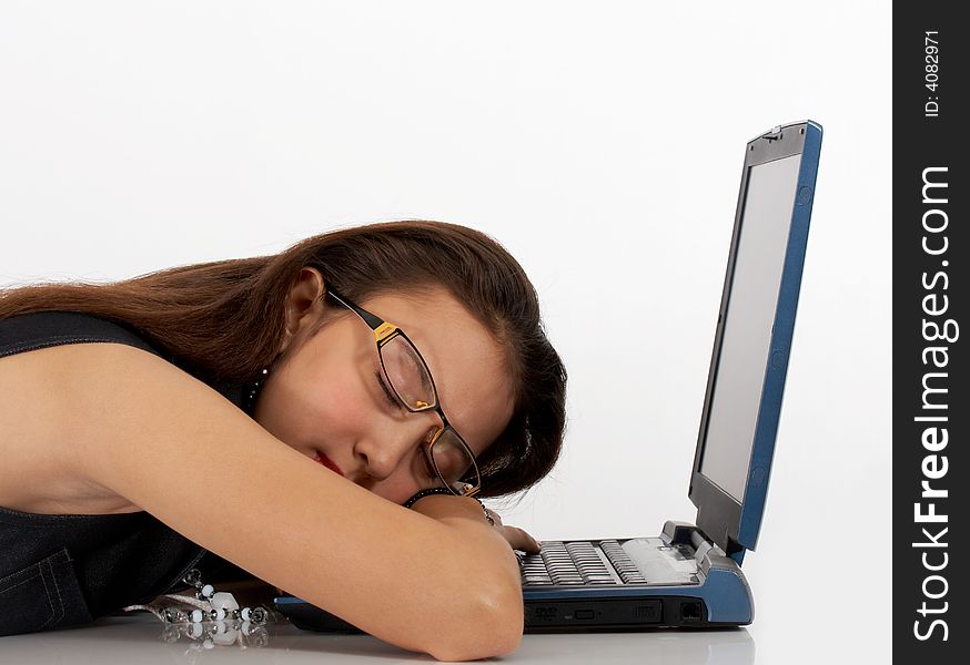 Secretary sleeping in front of her laptop