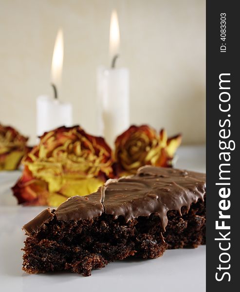 Chocolate cake with roses and candle light