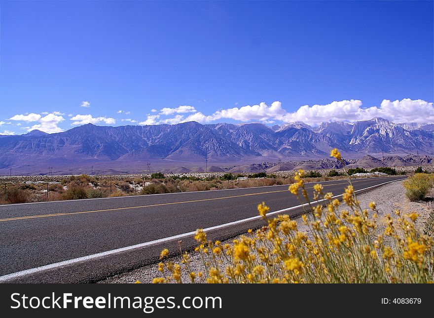 Empty highway with Sierra Mountains backdrop