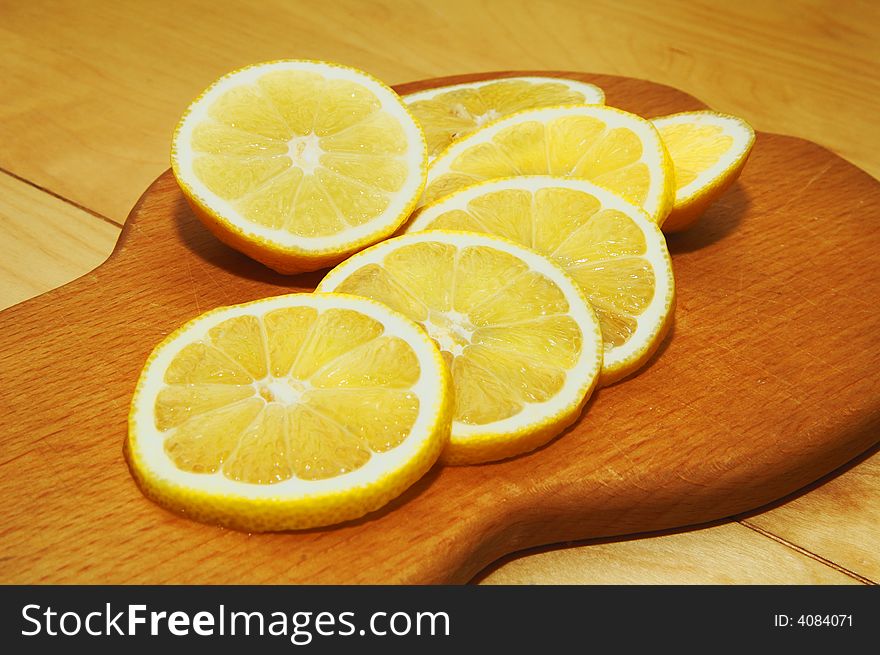 Fresh lemon on a wooden board