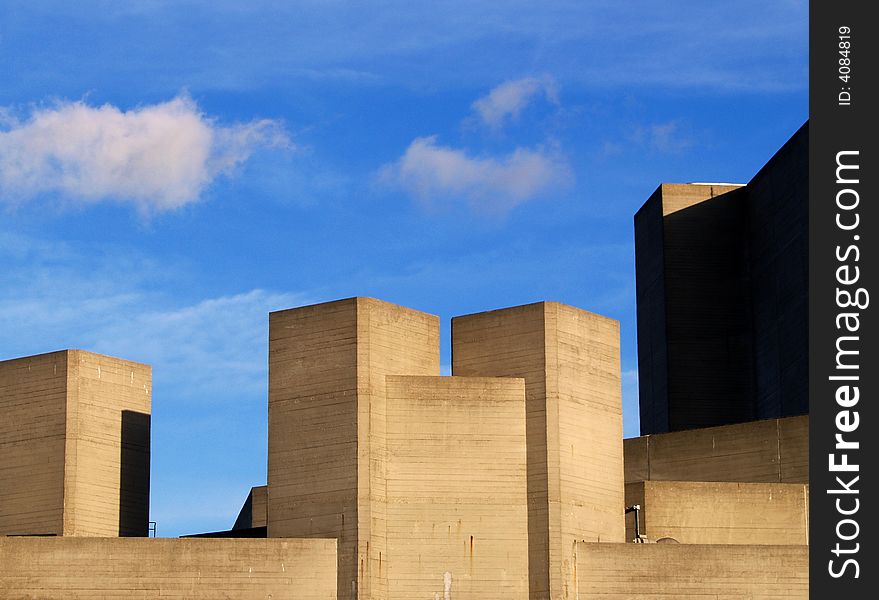 Contrast of the modern building of the Hayward Gallery against the sky, clouds and nature in London. Contrast of the modern building of the Hayward Gallery against the sky, clouds and nature in London