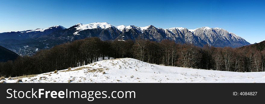 Bucegi Mountains, seen from Cumpatu ridge (over the Prahova Valley), near a shepherd house