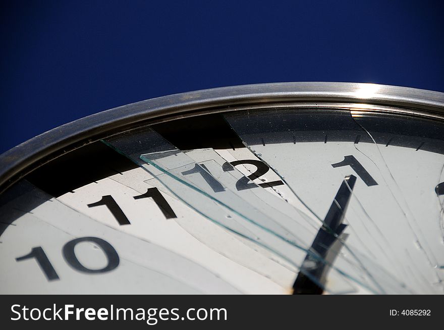 Detail of a clock with broken glass. Detail of a clock with broken glass