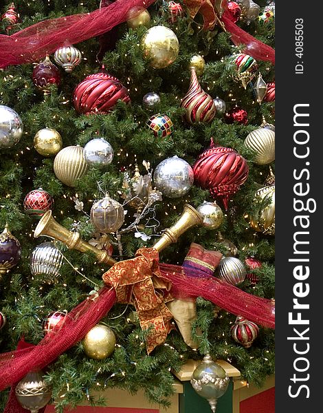 A christmas tree decorated with horns and balls and ribbons. A christmas tree decorated with horns and balls and ribbons