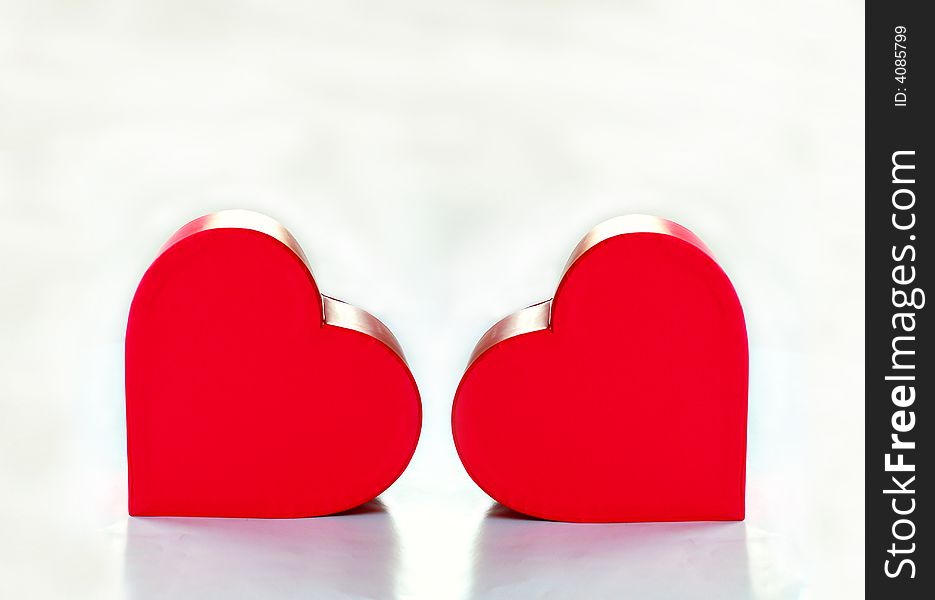 Two red heart over white background. Two red heart over white background