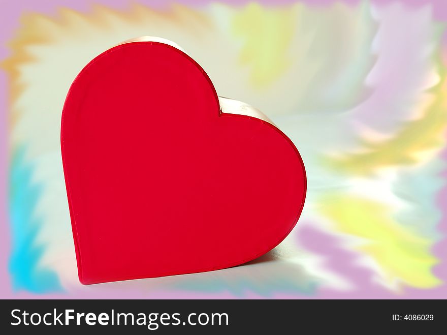 Red  heart box over colorful background. Red  heart box over colorful background