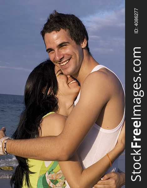 Teen couple having fun on the beach. Teen couple having fun on the beach