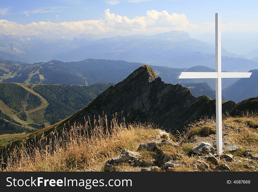 A cross on a high alpine ridge in France. A cross on a high alpine ridge in France.