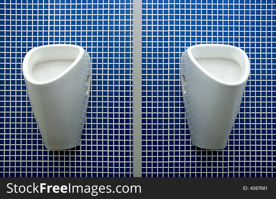 Clean toilet for man with blue background. Clean toilet for man with blue background