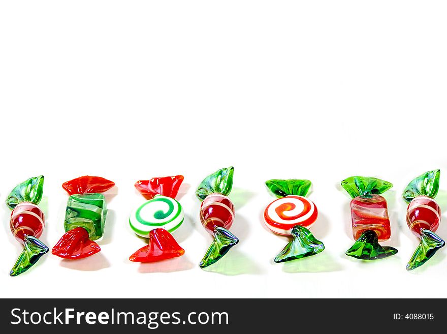 Here is a line of glass candies in red, green and white.