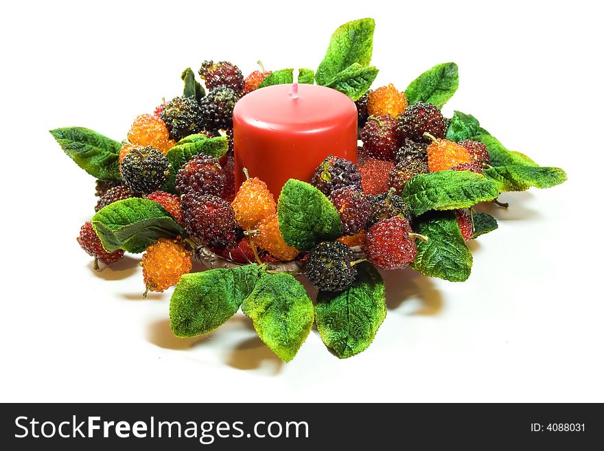 A beautiful candle ring with beaded fruit surrounding a fat red candle. A beautiful candle ring with beaded fruit surrounding a fat red candle.