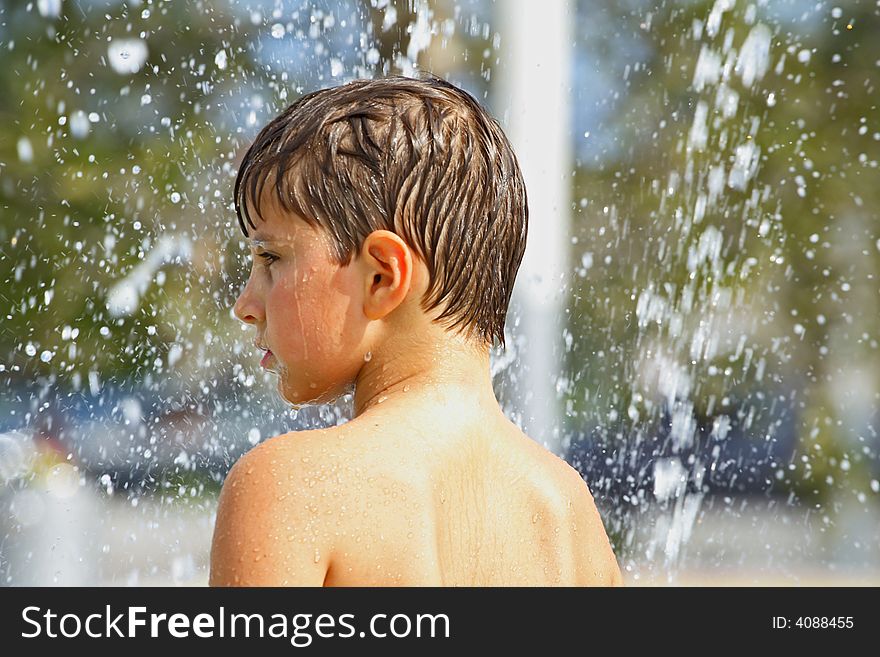 Boy playing with water