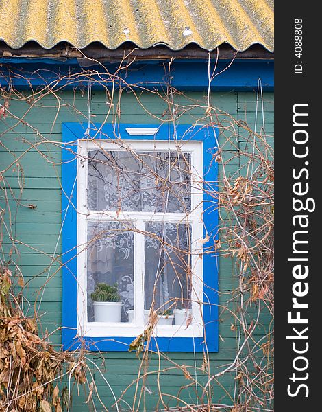 A window of a country wooden house. A window of a country wooden house