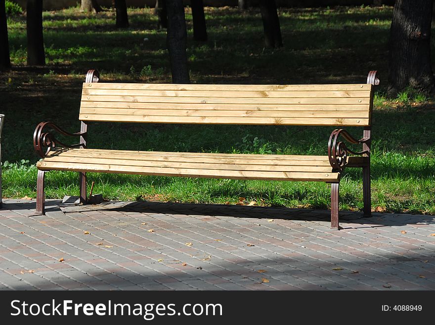 Bench in the sity park, in the sunny day