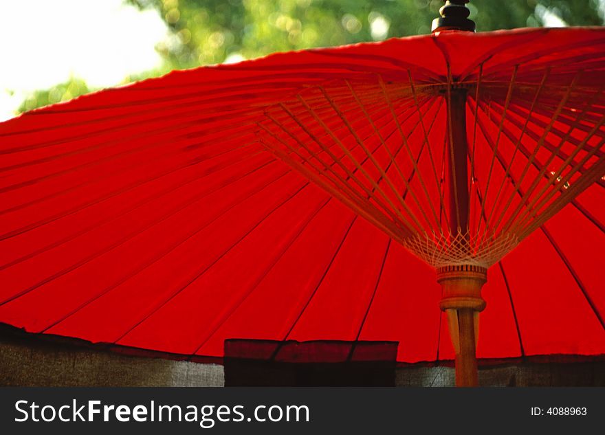 Red japanese umbrella in Bangkok park area