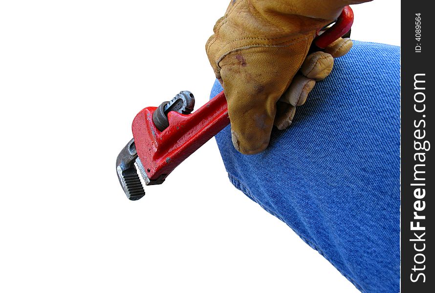 Construction worker with gloved hand holding wrench against a white background.