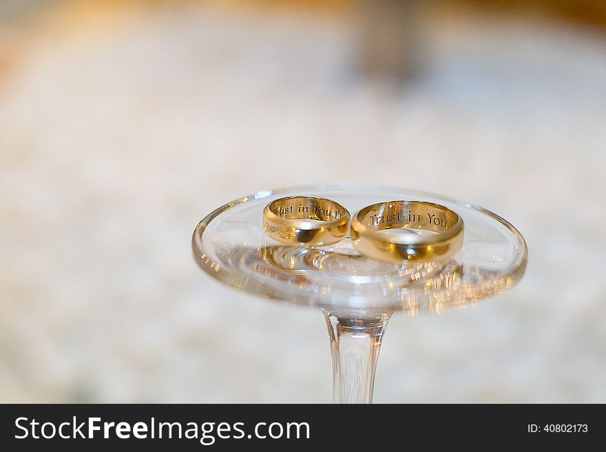 Golden wedding rings with inscription