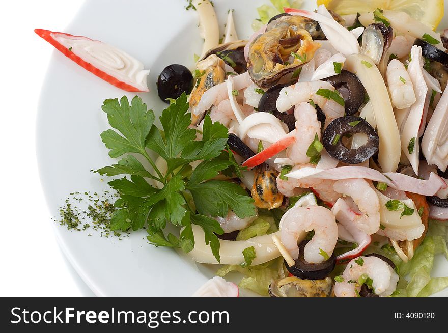 Prepared shrimp and mussel salad with olives, lemon and parsley