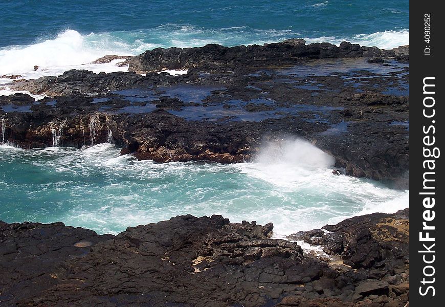 An inlet on the rocky shore of Kauai, Hawaii. An inlet on the rocky shore of Kauai, Hawaii