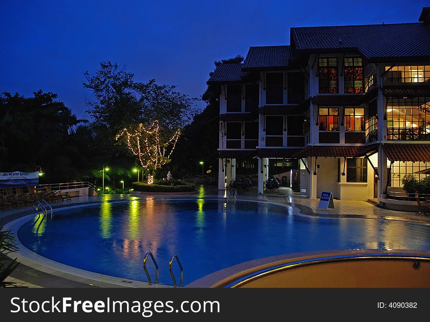 Night scene of hotel and swimming pools