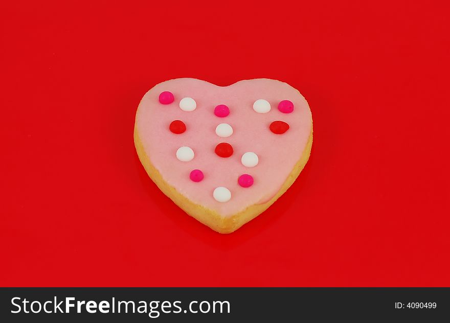 Valentine's Day heart shaped cookied against a red background. Valentine's Day heart shaped cookied against a red background.