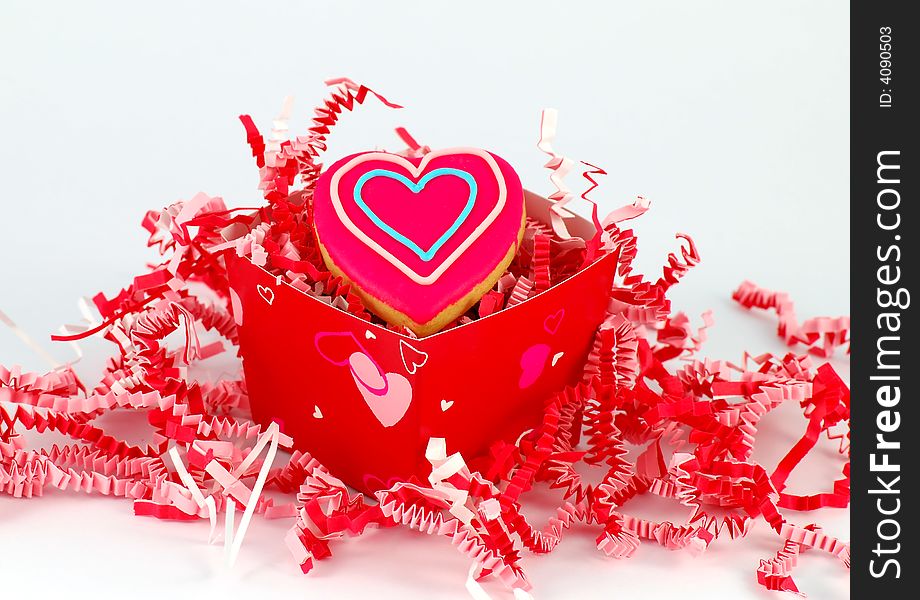 Valentine's Day heart shaped cookie in a red gift box. Valentine's Day heart shaped cookie in a red gift box.