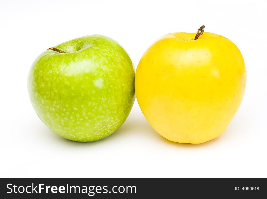 Fresh green and yellow apples at white background