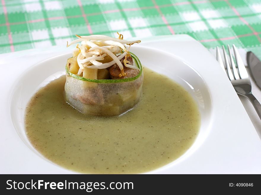 Cucumber wrapped chicken and potato chunks, topped with mung bean sprouts in cucumber sauce. Cucumber wrapped chicken and potato chunks, topped with mung bean sprouts in cucumber sauce