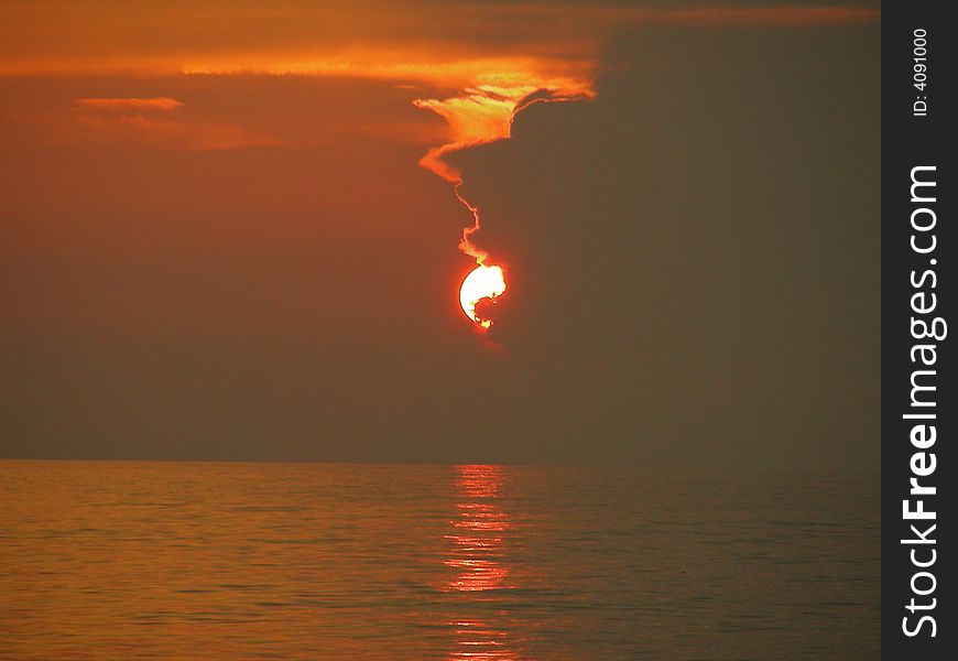 Red and cloudy ocean sunset. Red and cloudy ocean sunset