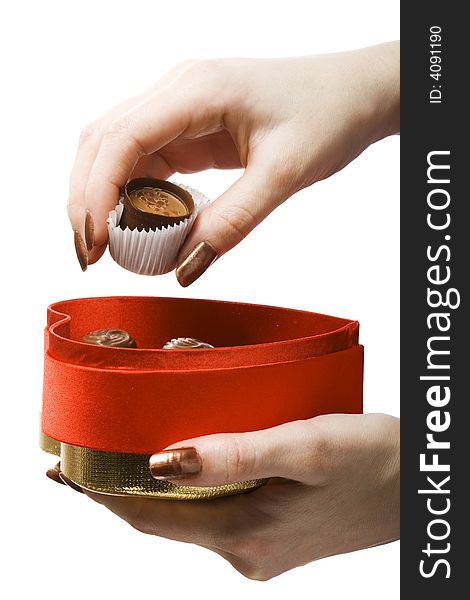 Woman hands holding box and chocolate candy