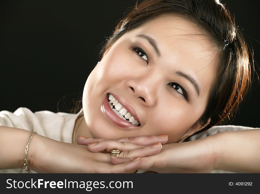 Asian girl looking up and smile. retouched with high fashion style. Asian girl looking up and smile. retouched with high fashion style