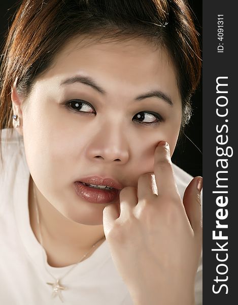 Asian girl with sad expression. retouched with high fashion style. Asian girl with sad expression. retouched with high fashion style