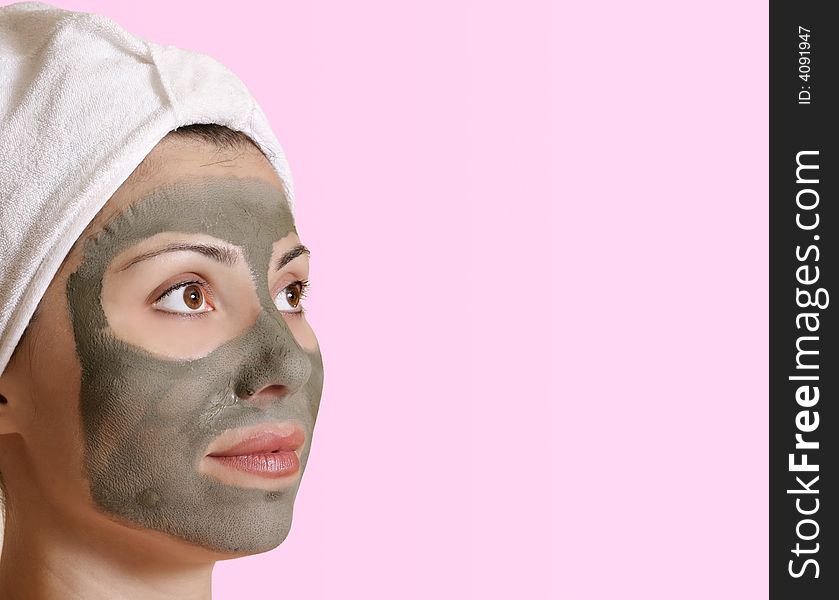 Female with a clay mask and space for  message. Female with a clay mask and space for  message.