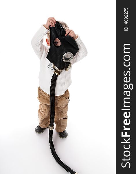 The kid and a gas mask. On a white background