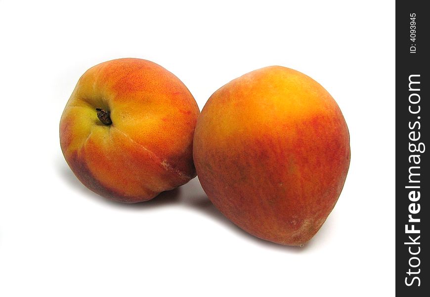 Two peaches isolated on a white background