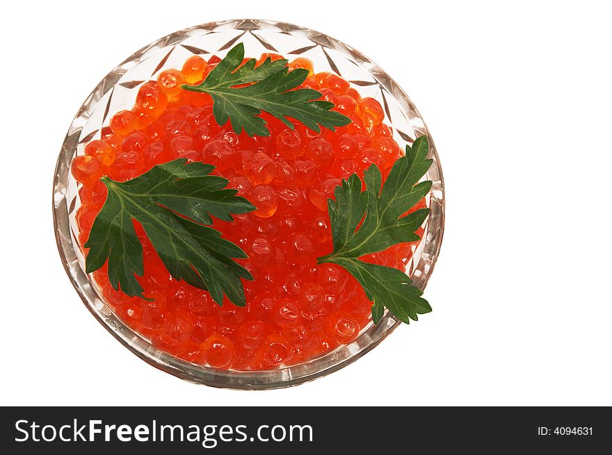 Crystal dish with red caviar on a white background