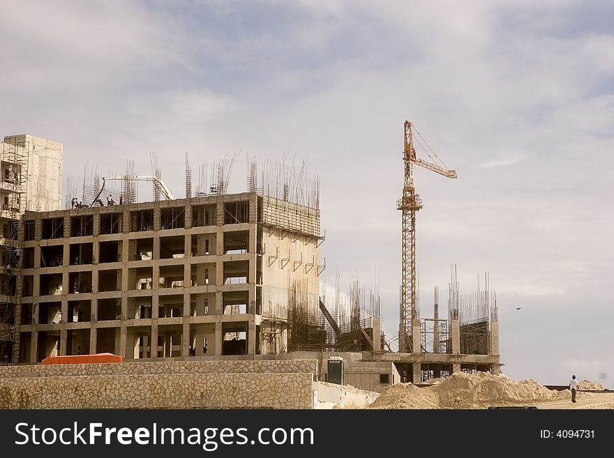 A beachfront condo construction project of steel and concrete. A beachfront condo construction project of steel and concrete