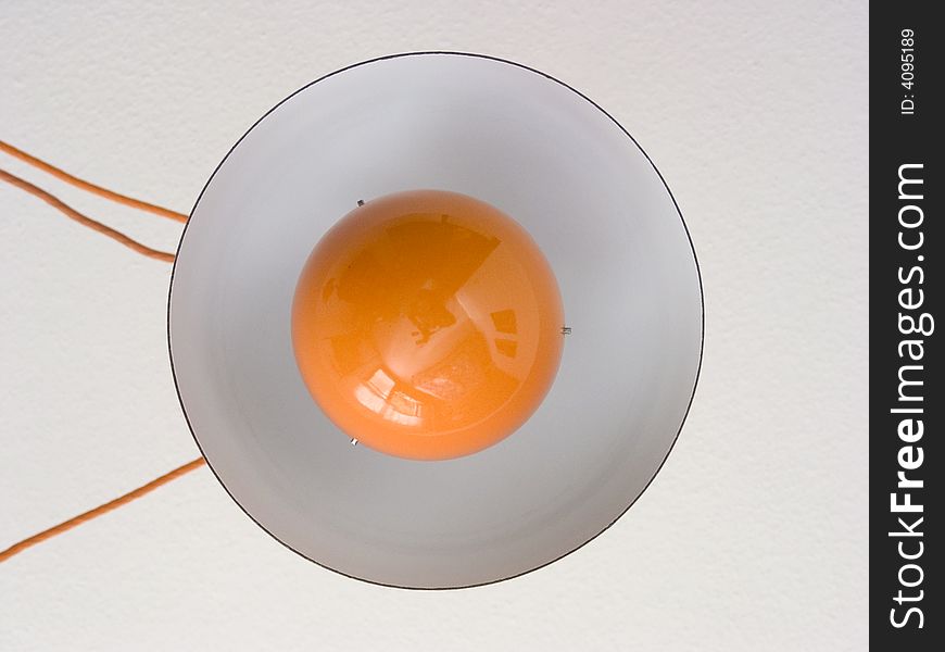 Lamp with orange light bulb