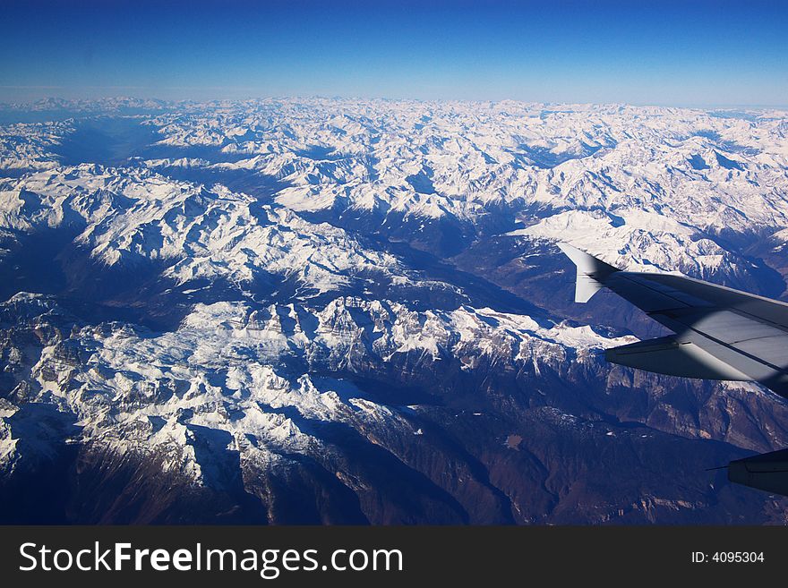 View on snow mountains from airplane