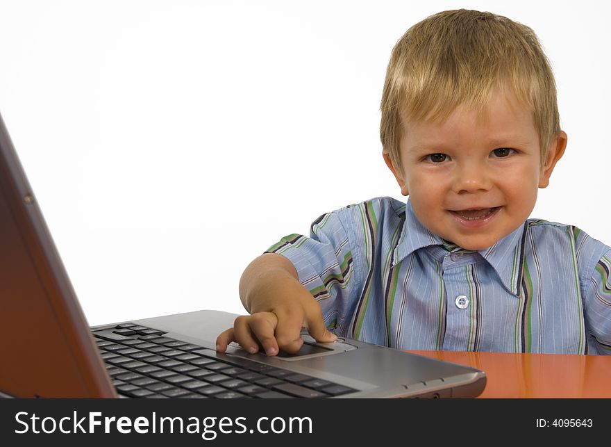 A Child With A Laptop.