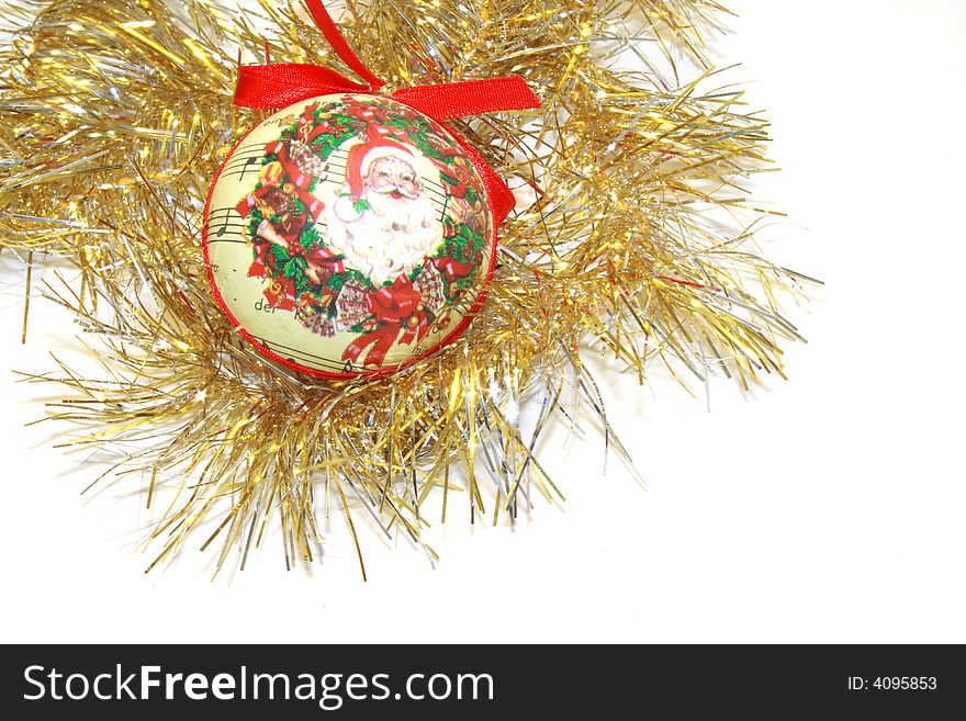 Gold tinsel with ornate papiermache bauble and bow christmas decorations for hanging on the christmas tree isolated over white background. Gold tinsel with ornate papiermache bauble and bow christmas decorations for hanging on the christmas tree isolated over white background
