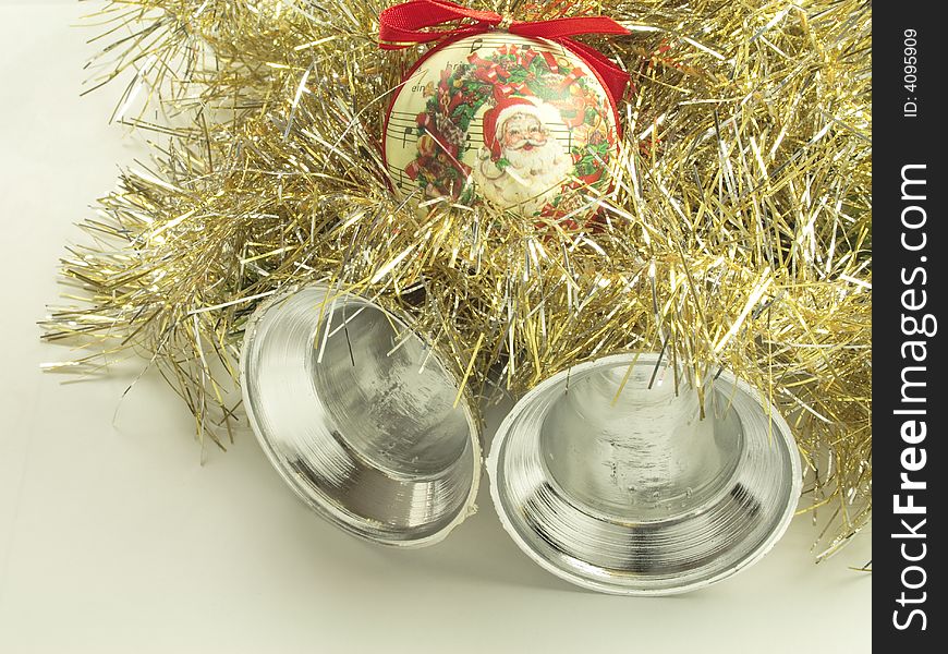 Silver bells with a santa bauble and tinsel