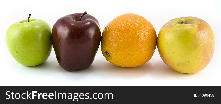 A Granny Smith, Fuji, Red Delicious apples and navel orange isolated on white background. A Granny Smith, Fuji, Red Delicious apples and navel orange isolated on white background.