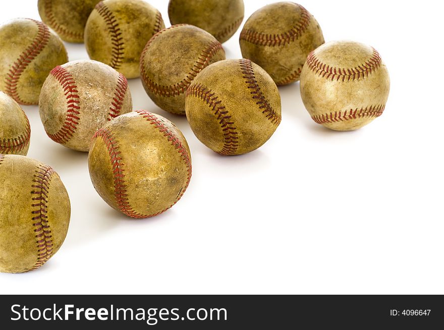 A background of vintage, antique, old baseballs on a white background with copy space. A background of vintage, antique, old baseballs on a white background with copy space