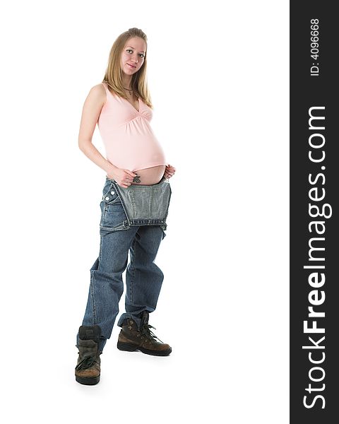 The pregnant woman in jeans on a white background