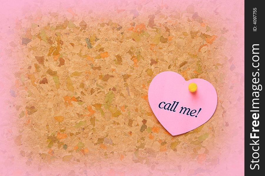 Cork board with heart shape sticky note. Call me inscription. Cork board with heart shape sticky note. Call me inscription