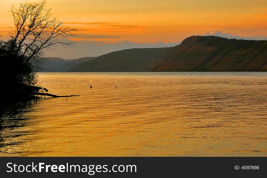 The river painted in orange color sunset