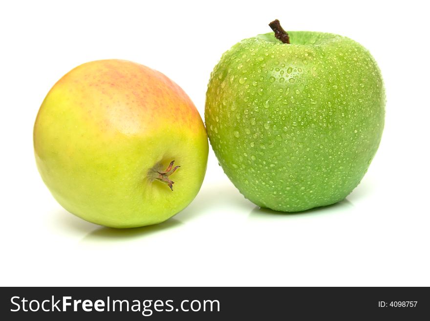 Green and yellow apples on white. Shallow DOF. Green and yellow apples on white. Shallow DOF.