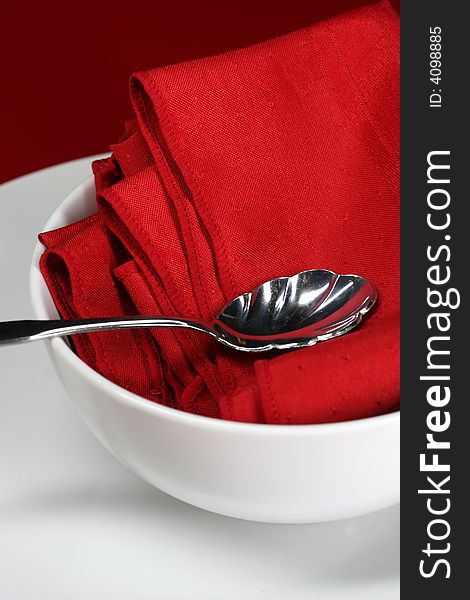 A close up of a modern table setting in red. A close up of a modern table setting in red