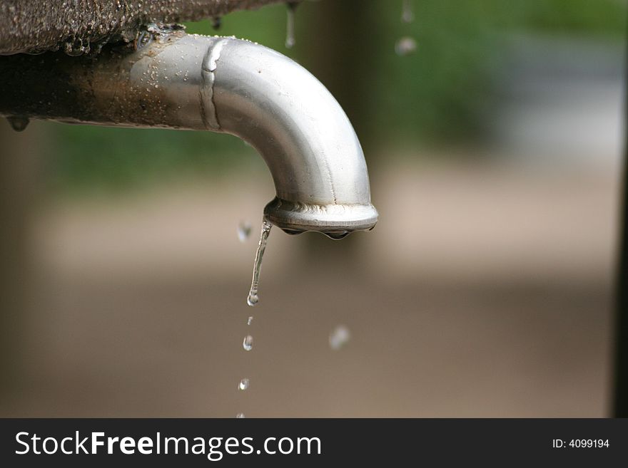 In a park i found this dripping crane and made a photo of it